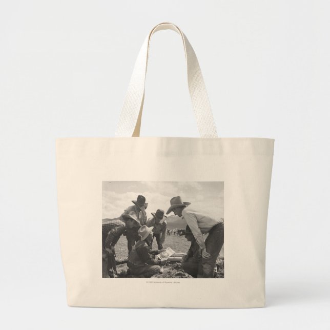 Cowboys looking a magazine large tote bag (Front)