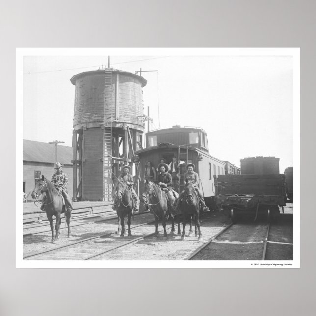 Cowboys on horses posing in front of a train poster (Front)