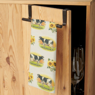Cows and sunflowers on folded linen texture tea towel