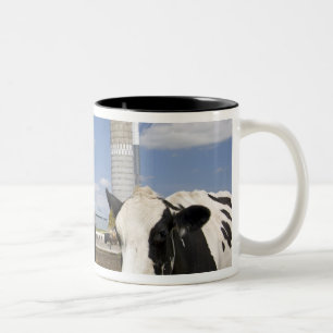 Cows in front of a red barn and silo on a farm Two-Tone coffee mug