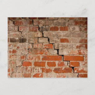 Cracked brick wall postcard