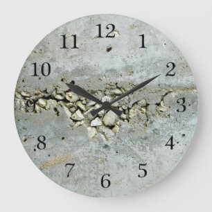Cracked concrete wall with small stones large clock