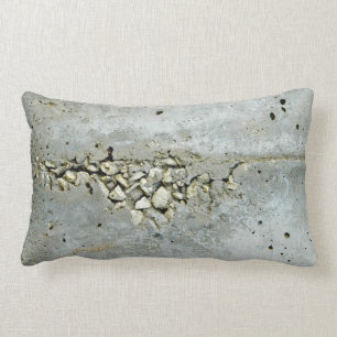 Cracked concrete wall with small stones lumbar cushion