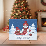 Crafty Snowman Knitting Scarf Holiday Postcard<br><div class="desc">Vector illustration of two adorable cartoon snowmen dressed in knitted hats and scarves. The big crafty snowman is knitting an oversized scarf for the little one. The scarf is already wrapped several times around the cute little snowman.</div>