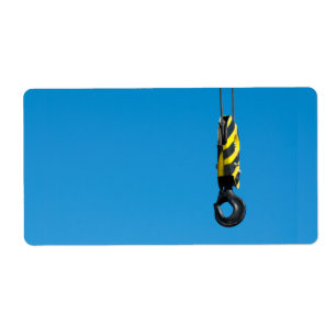 Crane hook with yellow and black stripes hanging