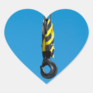 Crane hook with yellow and black stripes hanging heart sticker