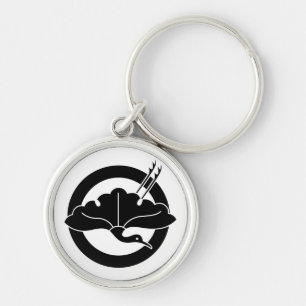 Crane-shaped ginkgo leaf on circle key ring