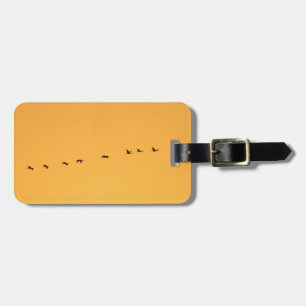 Cranes at sunrise luggage tag