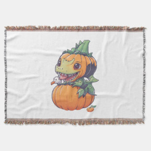 crazy pumpkin trying to eat spooky throw blanket