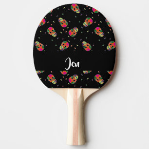 Crazy skulls on black ping pong paddle
