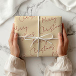 Cream and Red Merry Christmas  Wrapping Paper<br><div class="desc">Traditional,  plain-coloured wrapping paper. A modern cream colour with Merry Christmas in red handwritten font printed in a repeating pattern. Cream and Red Merry Christmas Wrapping Paper. Cream colour #FDE8C7. Carmine Red #8D011F.</div>