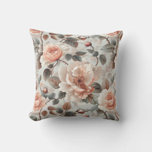 Cream flowers with grey leaves on a light grey cushion