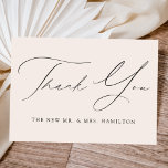 Cream Modern Elegance Wedding Thank You Card<br><div class="desc">Elegant wedding thank you card featuring "Thank You" in a black calligraphy script with your last name displayed below against a cream background. The elegant wedding thank you card reverses to display your custom thank you message and first names in black lettering. Design coordinates with our Modern Elegance wedding collection....</div>