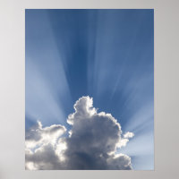 Crepuscular or God's rays streak past cloud.