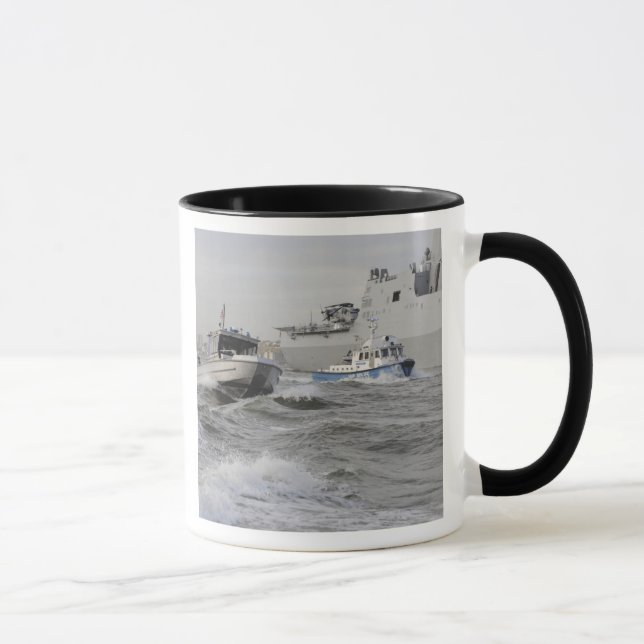 Crews from the coast guard and police departmen mug (Right)