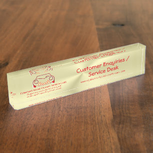 Crimson red classic luxury sports car logo on gold nameplate