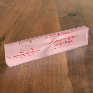 Crimson red classic luxury sports car logo on pink nameplate