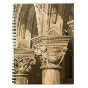 Croatia, Dalmatia, Dubrovnik. Stone arches and Notebook