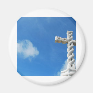 Cross in clouds and blue sky magnet