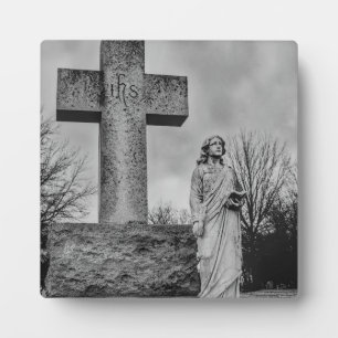 Crucifix and angel in black and white plaque