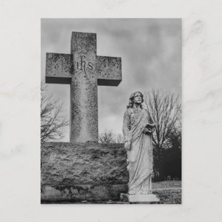 Crucifix and angel in black and white postcard
