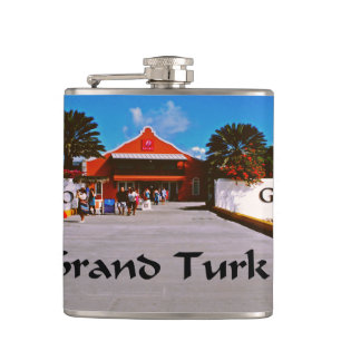 Cruise ship docked at a tropical exotic island hip flask