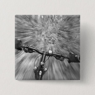 Cruising down a buff section of singletrack 15 cm square badge