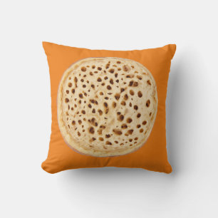 Crumpet on white cushion