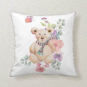 Cuddly teddy in flowers cushion