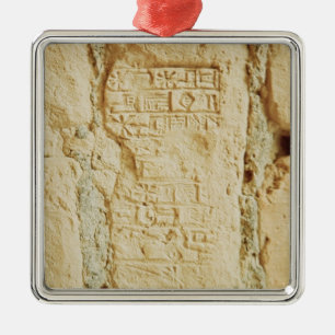 Cuneiform script on a palace wall metal tree decoration