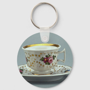Cup and saucer with colourful flower designs on key ring