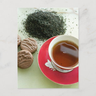 Cup of black tea with chocolate biscuits postcard