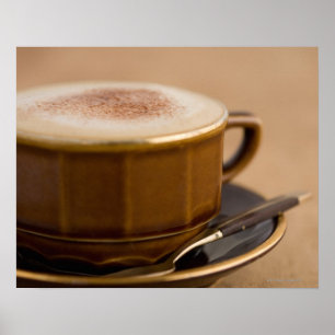 Cup of cappuccino with cocoa powder poster