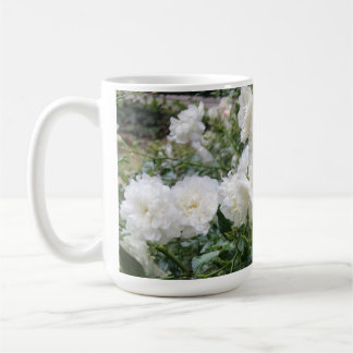 Cup with white antique roses