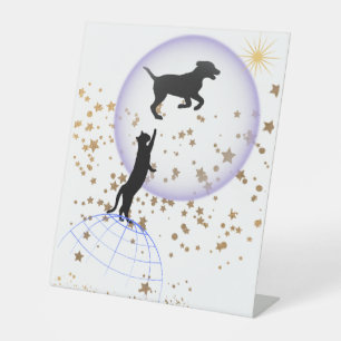 Curious cat and running dog pedestal sign