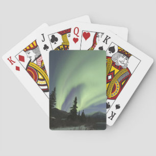 Curtains of green aurora borealis in the sky playing cards
