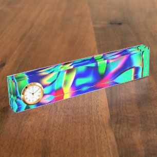 Curved and very colourful shapes, green prevails nameplate