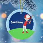 Custom Baseball Kid Ceramic Tree Decoration<br><div class="desc">Cool customised baseball player ornament for a child who plays Little League or T Ball. This cute Christmas gift features a kid wearing a red baseball uniform and holding a bat against a blue background on a green field. Personalise by adding a name in white on the blue sky.</div>