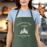 Custom Family Name Christmas Tree Farm Retro Apron<br><div class="desc">Cook up some holiday magic with this custom apron! Featuring your family name and a retro Christmas tree farm design in sage green,  it's the perfect festive touch for holiday baking and family meals.</div>