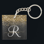 Custom Gold Glitter Black Sparkle Monogram Key Ring<br><div class="desc">Easily personalise this trendy elegant keychain design featuring pretty gold sparkling glitter on a black brushed metallic background.</div>