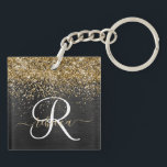 Custom Gold Glitter Black Sparkle Monogram Key Ring<br><div class="desc">Easily personalise this trendy elegant keychain design featuring pretty gold sparkling glitter on a black brushed metallic background.</div>
