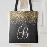 Custom Gold Glitter Black Sparkle Monogram Tote Bag<br><div class="desc">Easily personalise this trendy elegant tote bag design featuring pretty gold sparkling glitter on a black brushed metallic background.</div>