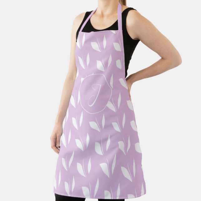 Custom initial white silhouette leaves purple apron (Insitu)