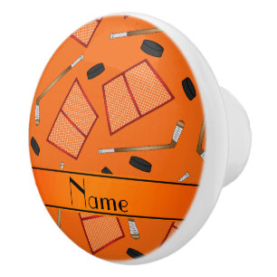 Custom name orange hockey sticks pucks nets ceramic knob
