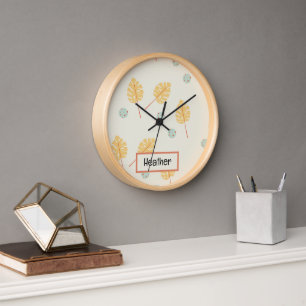 Custom name orange tropical leaves cream clock