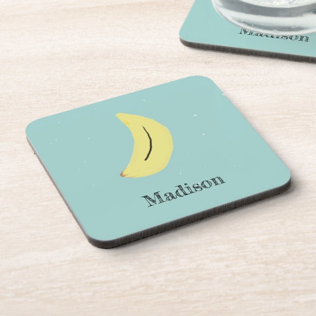 Custom name painted banana on blue coaster (Left Side)