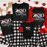 Custom Name Santa Hat Christmas Family Matching T-Shirt<br><div class="desc">Celebrate the magic of the season with the Custom Name Santa Hat Christmas Family Matching T-Shirt. Designed for festive fun, this shirt features playful Santa hats and a chic red colour scheme that embodies the holiday spirit. The modern, minimalist design, accented with a vintage script typeface, creates a stylish yet...</div>