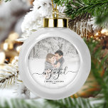 Custom Photo First Christmas Engaged Black Script Ceramic Ball Christmas Ornament<br><div class="desc">Commemorate your engagement with this beautiful modern keepsake ornament. The black text reads "Our first Christmas engaged, " with the word "engaged" in elegant handwriting script with flourishes before and after. Replace the sample image with your favourite photo, and add your names and the year. A white gradient filter helps...</div>