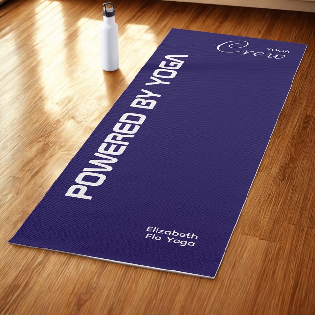 Custom Print Yoga Crew Dark Blue Mat (Dark blue yoga mat on studio floor.)