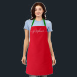Custom Red Christmas Simple Elegant script Name Apron<br><div class="desc">Do you know someone who would love a personalised apron as she bakes those goodies, cooks delicious dishes in holiday colours (red and green). A perfect gift to encourage her talents on the holidays. Black script for the name with long-tail embellishments. Pro tip: keep the little square for the long-tailed...</div>